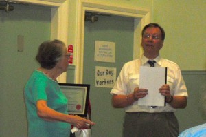 Edna receiving honorary membership from Chairman Ray Smith
